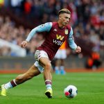 Grealish lifting a trophy for Villa