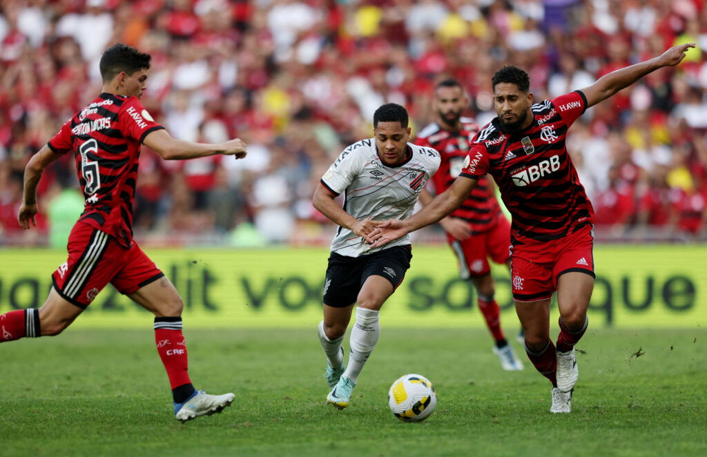 Athletico Paranaense's Vitor Roque in action with Flamengo's Pablo