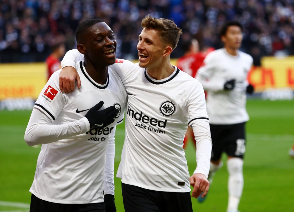 Eintracht Frankfurt's Randal Kolo Muani celebrates scoring their first goal with Jesper Lindstrom