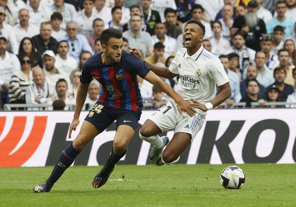 FC Barcelona's Eric Garcia fouls Real Madrid's Rodrygo to concede a penalty kick