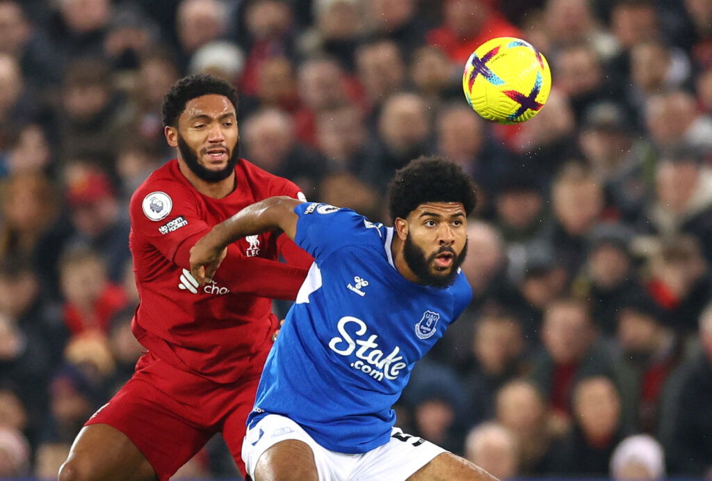 Liverpool's Joe Gomez in action with Everton's Ellis Simms