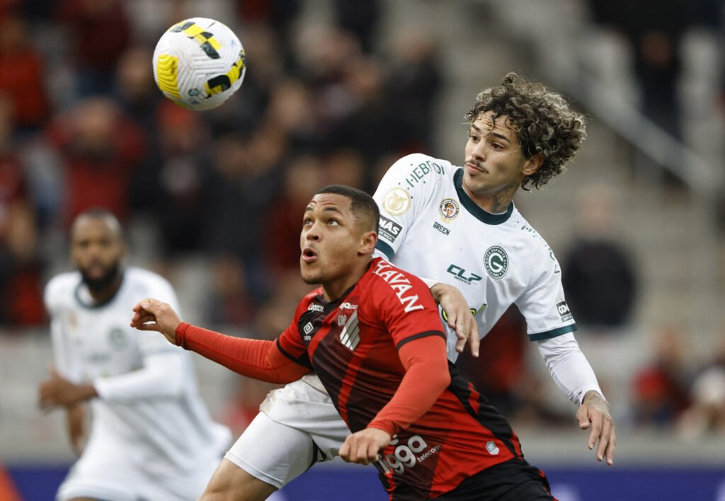 Athletico Paranaense's Vitor Roque in action with Goias' Yan Souto