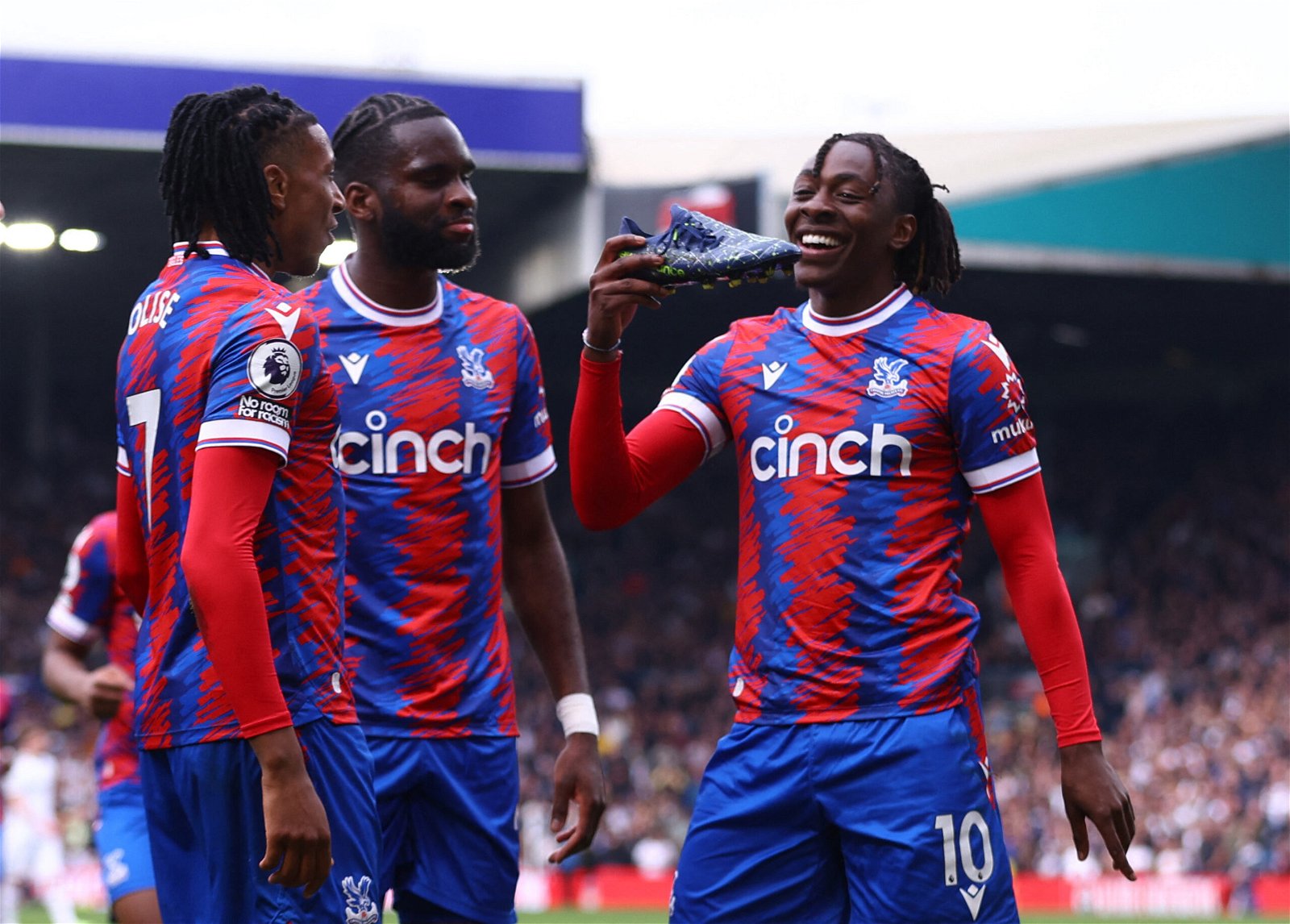Crystal Palace's Eberechi Eze celebrates scoring their third goal with Michael Olise and Odsonne Edouard