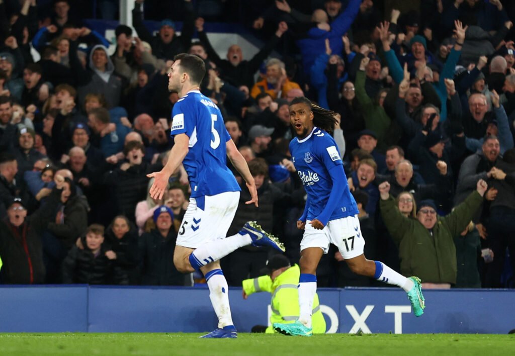 Everton's Michael Keane celebrates scoring their first goal with Alex Iwobi