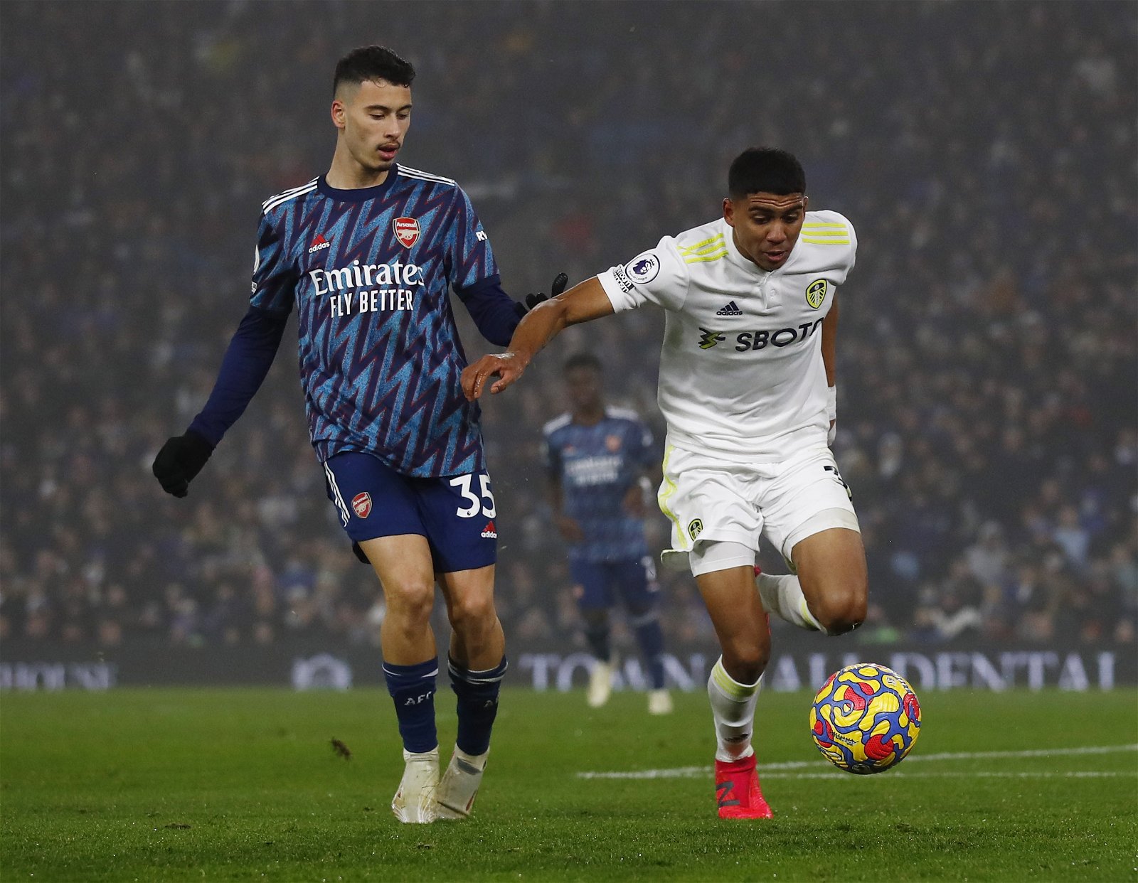Leeds United's Cody Drameh in action with Arsenal's Gabriel Martinelli