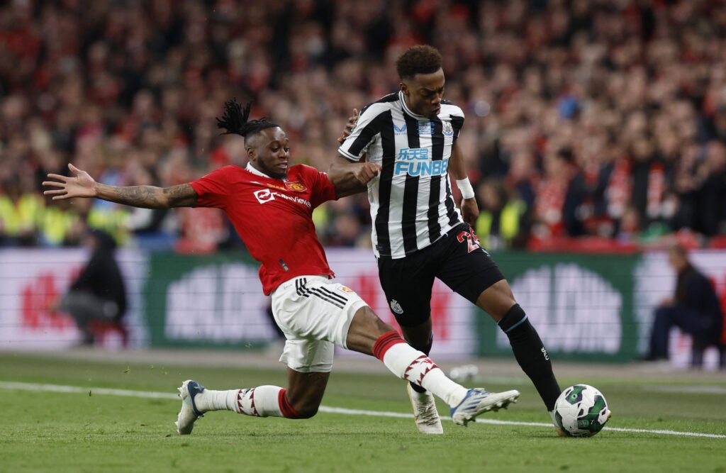 Manchester United's Aaron Wan-Bissaka in action with Newcastle United's Joe Willock