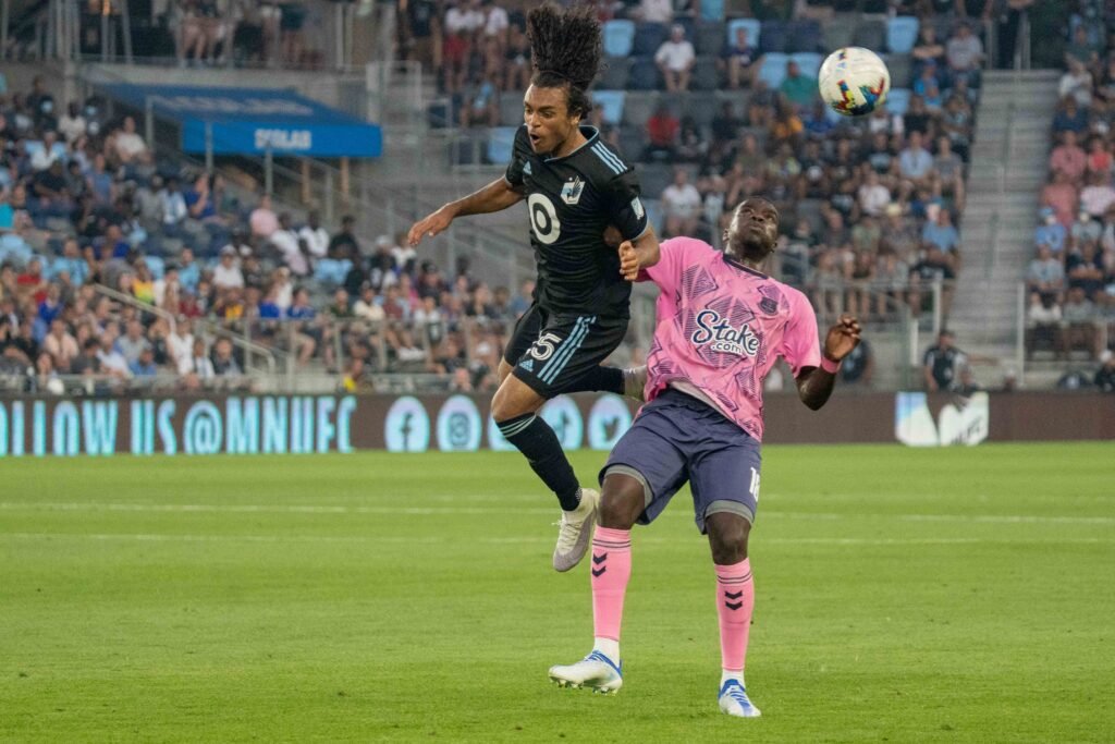Minnesota United midfielder Aziel Jackson (25) makes a play over Everton defender Niels Nkounkou (18) in the second half at Allianz Field