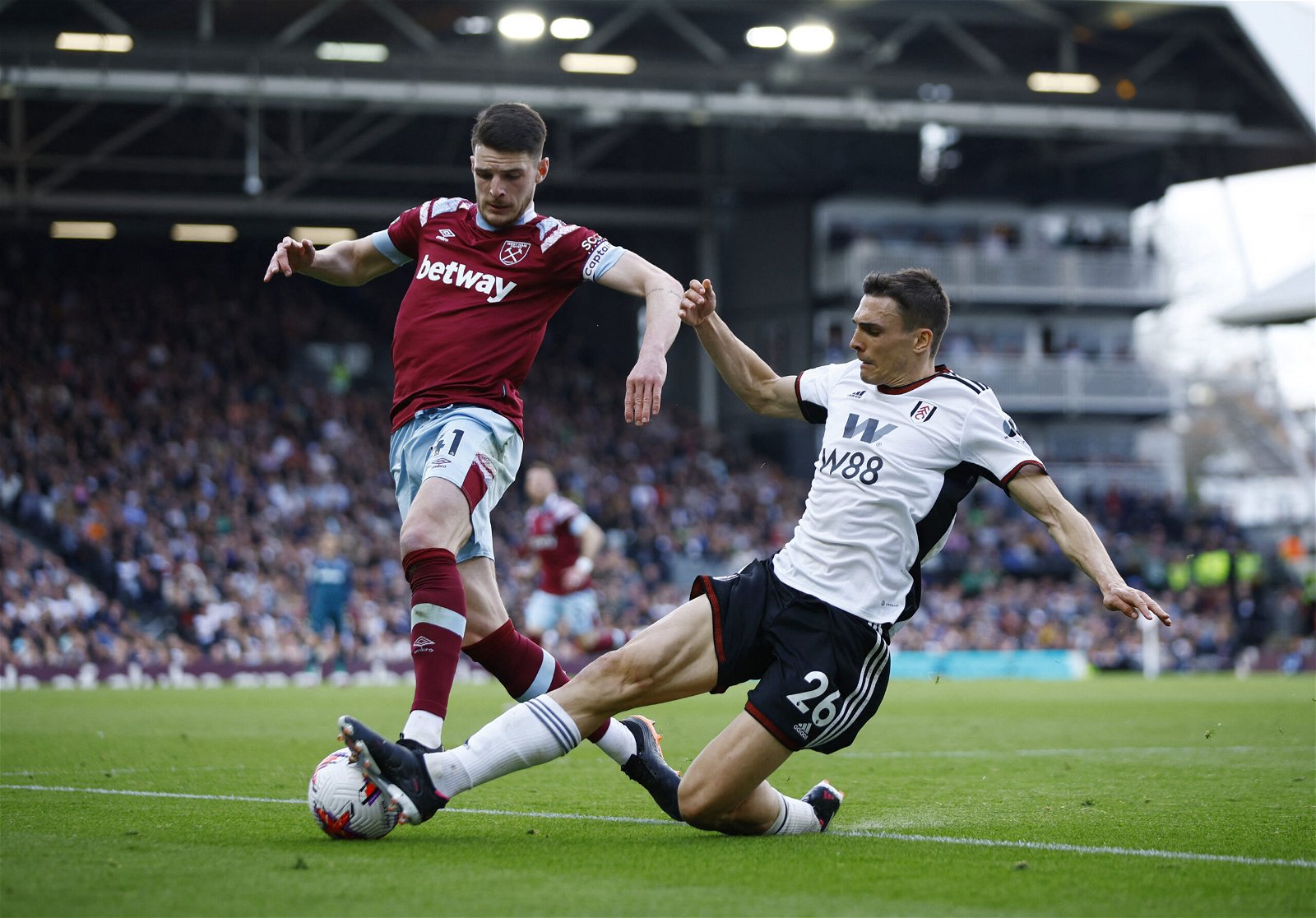 West Ham United's Declan Rice in action with Fulham's Joao Palhinha